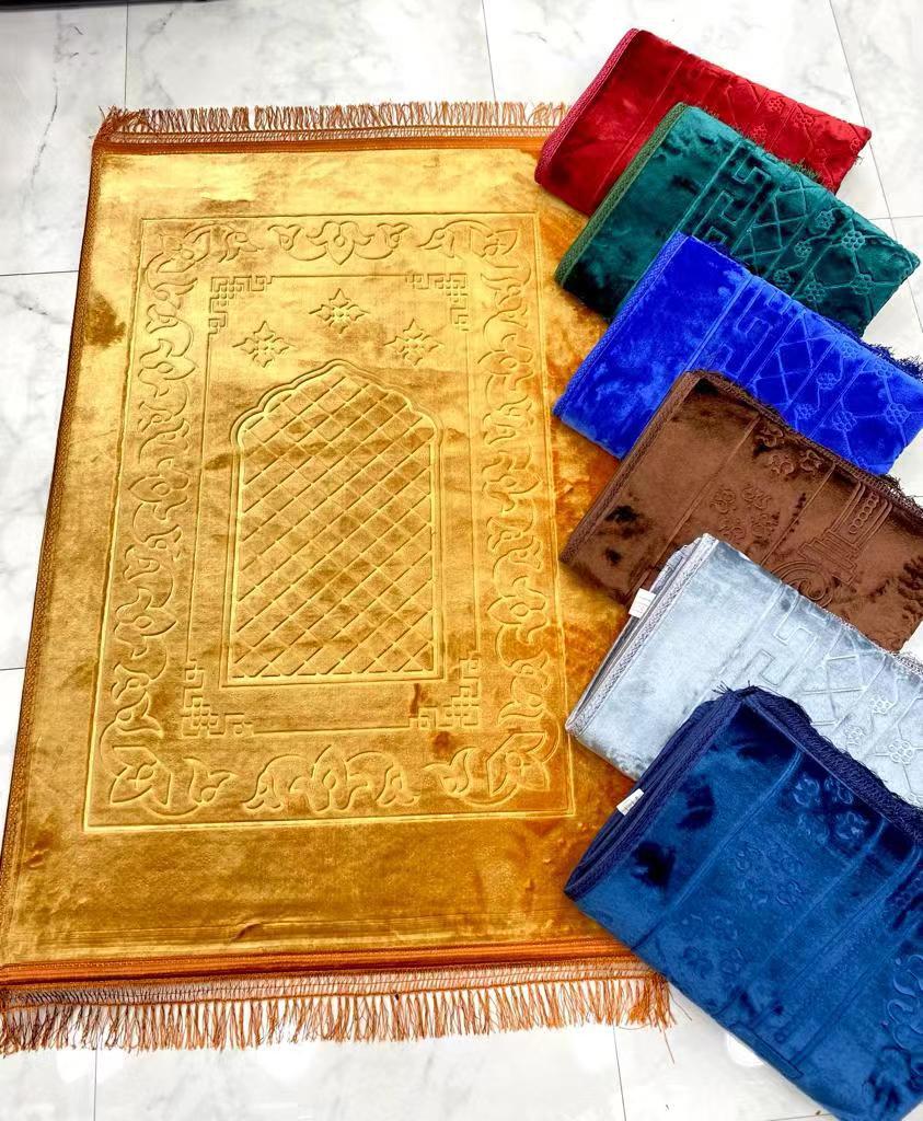 Golden Raschel embossed prayer mat with tassels, solid color, soft fabric, and intricate embossed design for prayer and meditation.