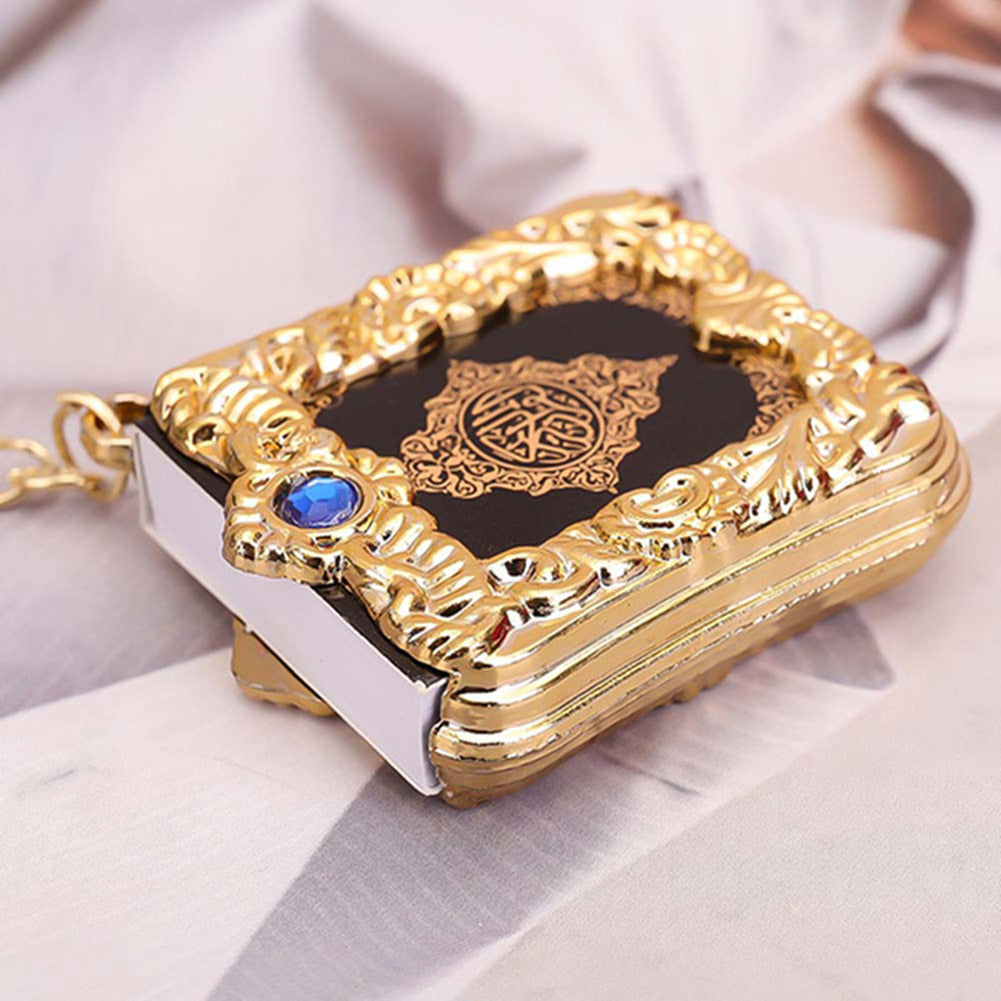 Golden Quran keychain pendant with hanging ring, featuring intricate design and Islamic calligraphy, ideal as a religious accessory.