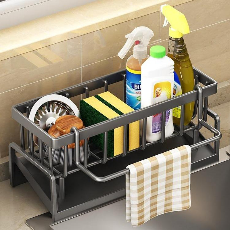 Stainless steel kitchen sink drying rack with sponge holder and multifunctional storage organizer for household use.
