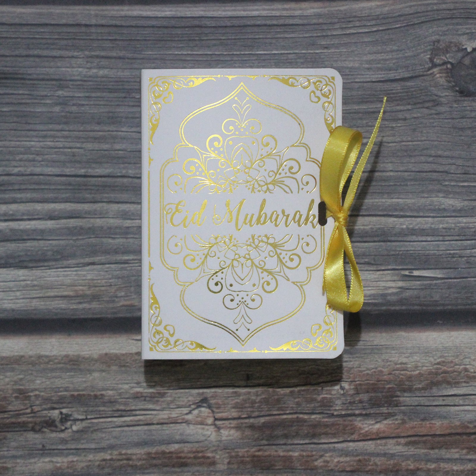 Golden Ramadan Gift Box featuring Quran elements and ornaments, beautifully designed for celebrating Ramadan.