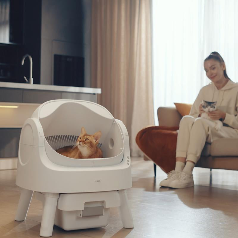 RoyalSavings Petpivot Autoscooper 11 open-top self-cleaning cat litter box with odor-free waste disposal and included trash bags.