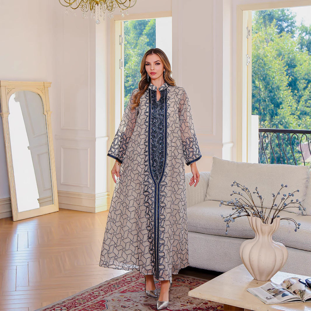 Golden Muslim female robe dress featuring traditional Middle East clothing style, long flowing fabric with intricate design details.