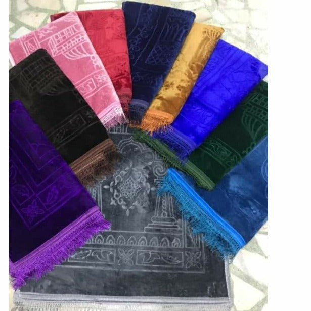 Golden Raschel embossed prayer mat with tassels in solid color, featuring detailed textured design and soft fabric.