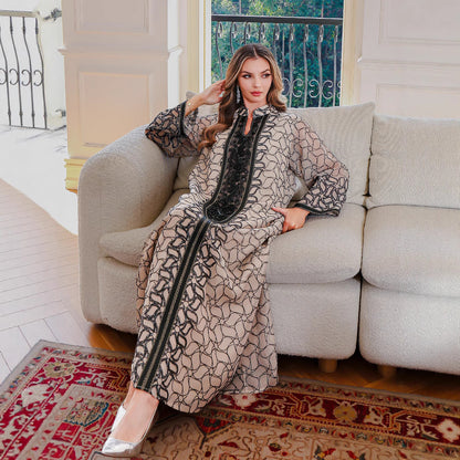 Golden Muslim female robe dress, Middle Eastern style, featuring modest design and elegant fabric, suitable for traditional attire.