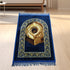 Golden thick flannel Qibla prayer mat with stain-resistant fabric, designed for comfortable and convenient Islamic prayer.