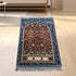 Golden thick flannel Qibla prayer mat with stain-resistant design, showing a soft, comfortable surface suitable for daily prayer.