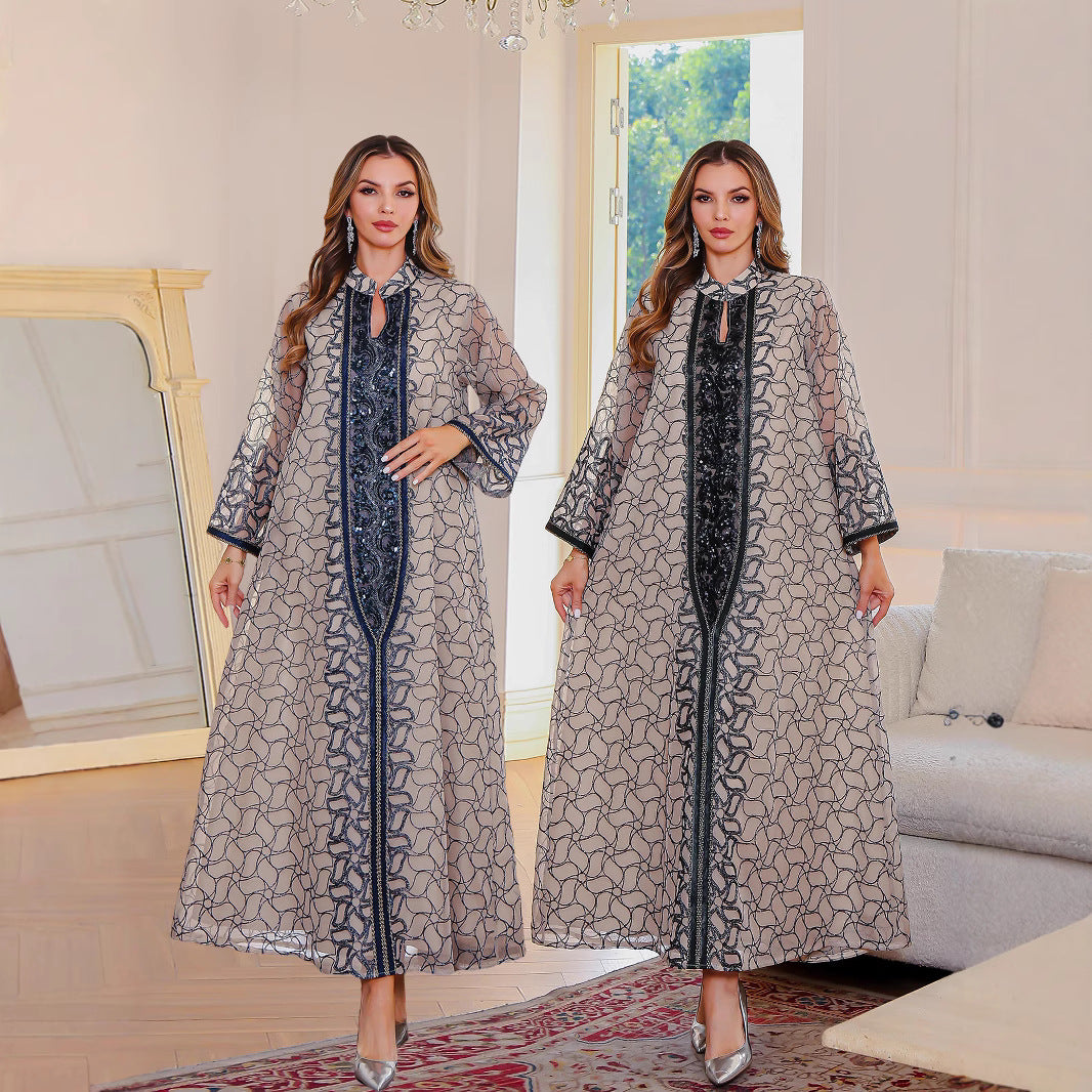Golden Muslim female robe dress with traditional Middle East design, featuring modest coverage and elegant fabric.