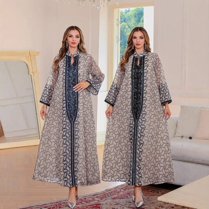 Golden Muslim female robe dress with traditional Middle East design, featuring modest coverage and elegant fabric.