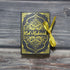 Golden Ramadan Gift Box featuring Quran elements and Ramadan ornament, elegantly designed for special occasion gifting.
