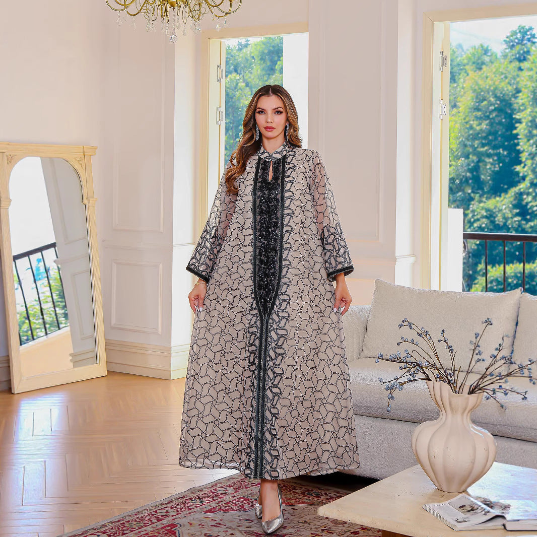 Golden Muslim female robe dress with modest Middle Eastern style, featuring flowing fabric and traditional design.