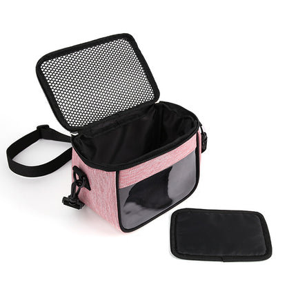 Golden crossbody pet bag for hamsters, showing a compact hamster cage with transparent sides and adjustable strap.