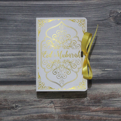 Golden Ramadan Gift Box featuring Quran elements and ornaments, beautifully designed for celebrating Ramadan.