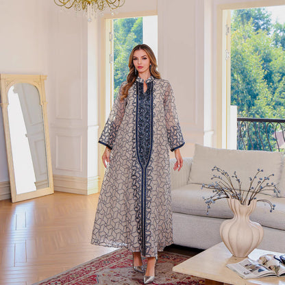 Golden Muslim female robe dress featuring traditional Middle East clothing style, long flowing fabric with intricate design details.