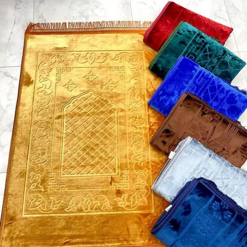 Golden Raschel embossed prayer mat with tassels in solid color, featuring intricate patterns and a soft, textured surface.