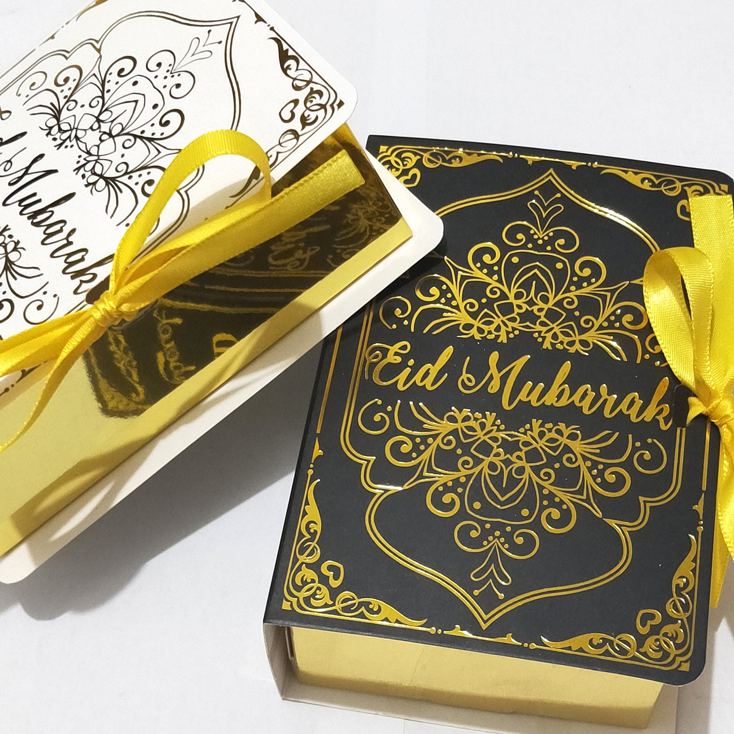 Golden Ramadan gift box with Quran-themed ornaments and decorative elements for celebrating Ramadan.