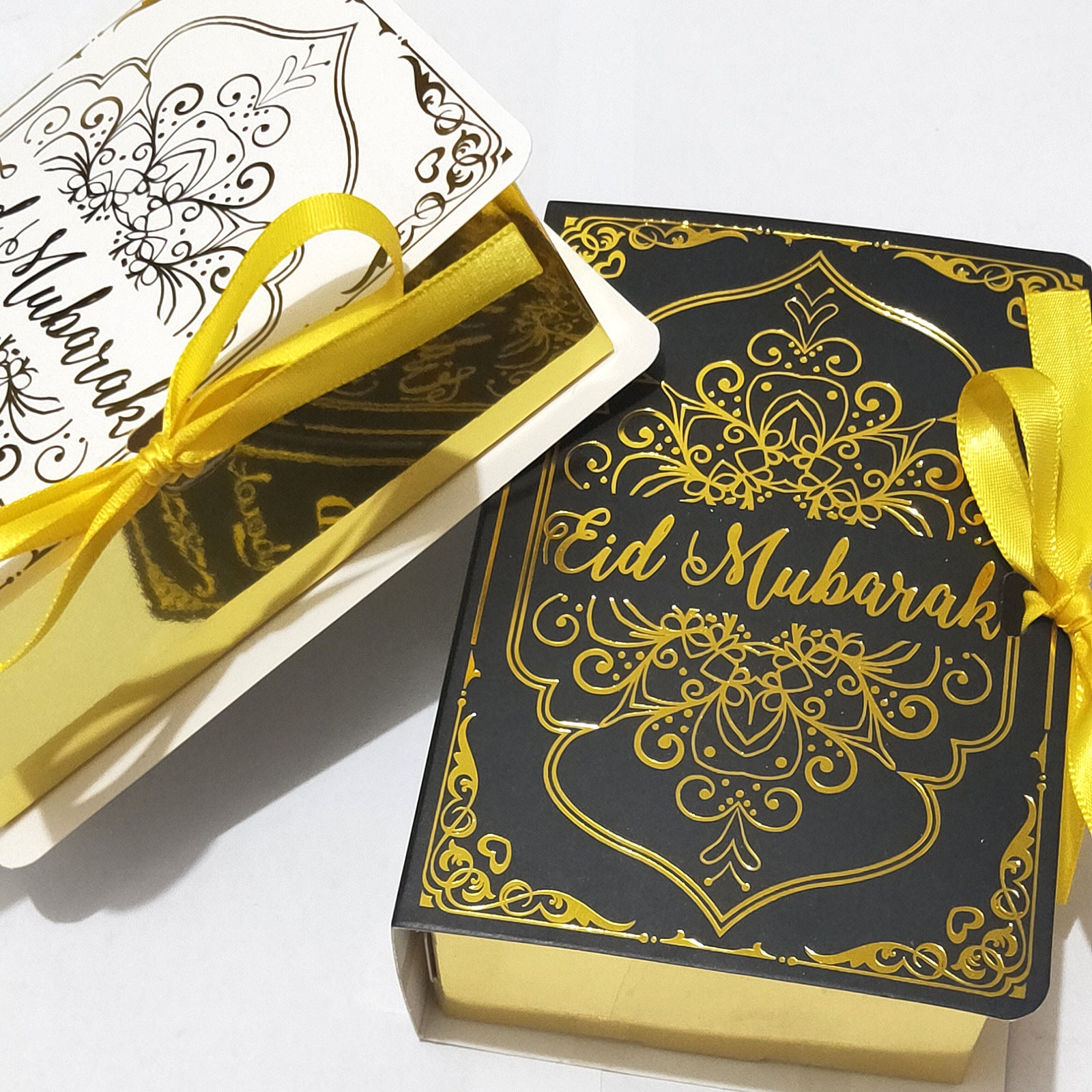 Golden Ramadan gift box with Quran-themed ornaments and decorative elements for celebrating Ramadan.